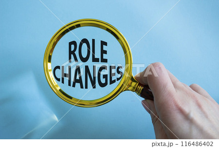 Role changes symbol. Concept words Role changes on magnifying glass. Businessman hand. Beautiful blue background. Business and Role changes concept. Copy space. Role changes symbol. Concept words Role changes on magnifying glass. Businessman hand. Beautiful blue background. Business and Role changes concept. Copy space. 116486402