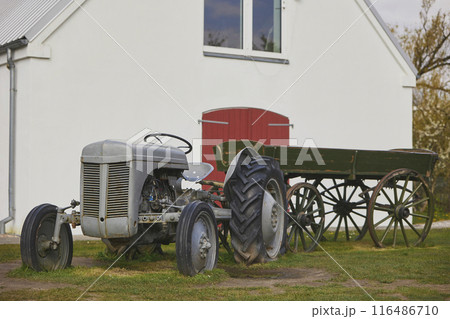 Vintage tractor and cart at the ranch in Denmark Vintage tractor and cart at the ranch in Denmark 116486710