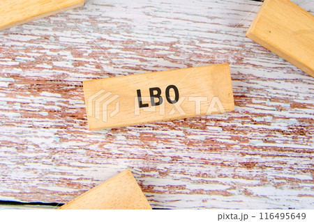 Leveraged Buyout LBO text on wooden blocks on old board Leveraged Buyout LBO text on wooden blocks on old board 116495649
