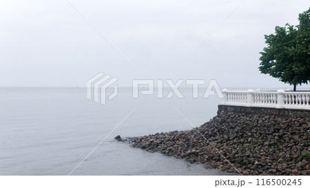 vintage white balustrade on a stone terrace above the sea shore vintage white balustrade on a stone terrace above the sea shore 116500245