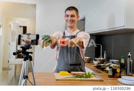 The chef is broadcasting live from workshop how to prepare a vegetarian food 116500296
