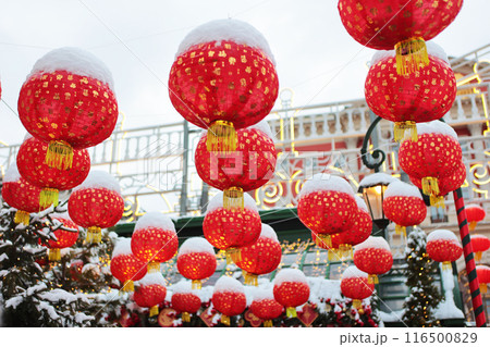 Red Chinese lanterns in the snow. Chinese New Year. Chinese New Year holiday. Without people. 116500829