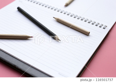 Notebook with pencils on pink background. Work planning Notebook with pencils on pink background. Work planning 116501737