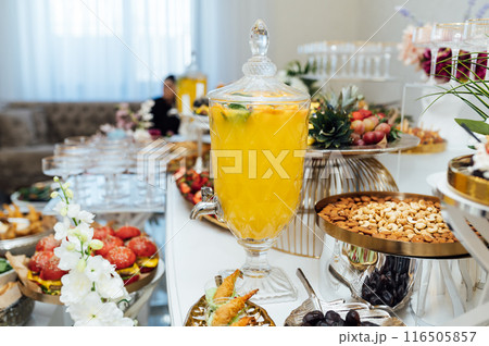 A wide variety of snacks on the table for guests. Shrimp, boiled pork, various types of meat and other products A wide variety of snacks on the table for guests. Shrimp, boiled pork, various types of meat and other products 116505857
