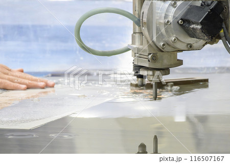 Close-up scene of multi-axis abrasive waterjet cutting machine cutting the aluminum plate. 116507167