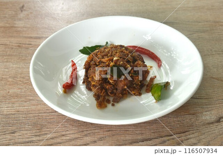 spicy fried chop fermenting fish with herb and chili on plate 116507934