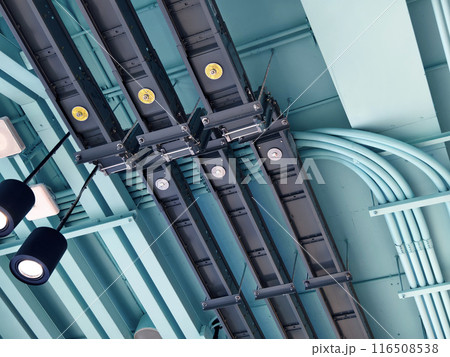 Ceiling with ventilation pipes and lights in industrial building 116508538