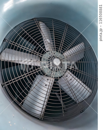 Close-up of a large, gray, industrial fan 116508881