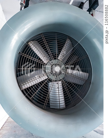 Close-up of a large, gray, industrial fan 116508882