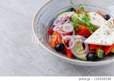 Best Salad with Vegetables and Feta Cheese in Beautiful Dishes on Gray Background, Fitness Salad, Photo for Menu Best Salad with Vegetables and Feta Cheese in Beautiful Dishes on Gray Background, Fitness Salad, Photo for Menu 116509196