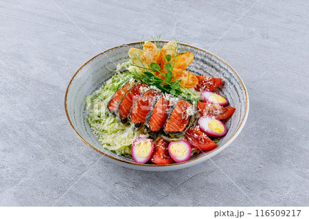 Salad with salmon, quail eggs, tomatoes, Parmesan and croutons for the menu of a food delivery site 116509217