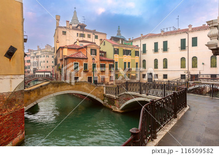 Old traditional Venetian houses along the canals at dawn. Old traditional Venetian houses along the canals at dawn. 116509582