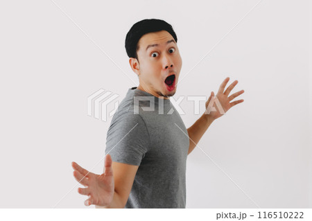 Wow and surprised face of man in grey t-shirt isolated on white background. Wow and surprised face of man in grey t-shirt isolated on white background. 116510222