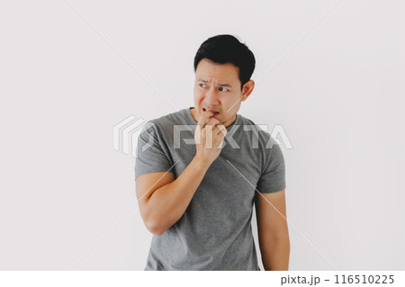 Sad and depressed humbly man in grey t-shirt isolated on white. Sad and depressed humbly man in grey t-shirt isolated on white. 116510225