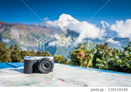 Compact digital camera in front of beautiful mountain view, Anna 116510288