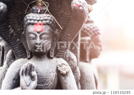 Buddha in a stone sculpture in Swayambhunath, Nepal Buddha in a stone sculpture in Swayambhunath, Nepal 116510295