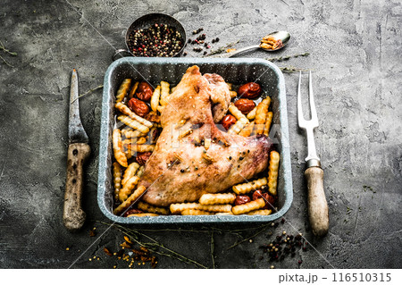 Fried turkey wing with fries in baking tray top view Fried turkey wing with fries in baking tray top view 116510315