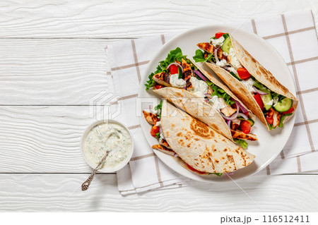 grilled chicken street tacos on a white plate grilled chicken street tacos on a white plate 116512411