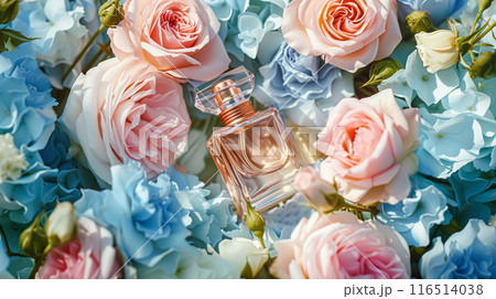 Perfume bottle with beautiful flowers. Floral background. Beauty concept. Flat lay, top view. Perfume bottle with beautiful flowers. Floral background. Beauty concept. Flat lay, top view. 116514038