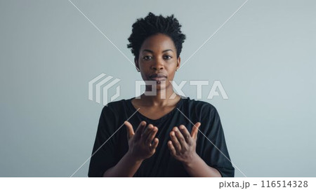 The interpreter using the hand signal with grey background as wallpaper. AIG43. 116514328