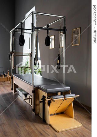 Modern Pilates studio with bright, spacious windows for exercise and wellbeing Modern Pilates studio with bright, spacious windows for exercise and wellbeing 116515054