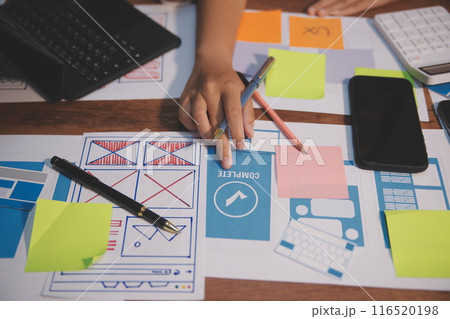 The designer team is designing the uxui system to make the uxui system work well on new phones and support system updates. Website development concept UI UX front end designer 116520198