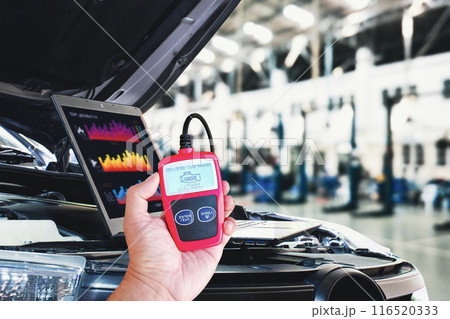 OBD2 or OBD scanner tool and laptop for engine system analysis to fixing car OBD2 or OBD scanner tool and laptop for engine system analysis to fixing car 116520333