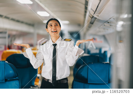 Portrait of a trained airplane captain in uniform preparing to fly, event planning in airplane. Portrait of a trained airplane captain in uniform preparing to fly, event planning in airplane. 116520703