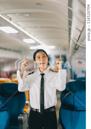 Portrait of a trained airplane captain in uniform preparing to fly, event planning in airplane. Portrait of a trained airplane captain in uniform preparing to fly, event planning in airplane. 116520704