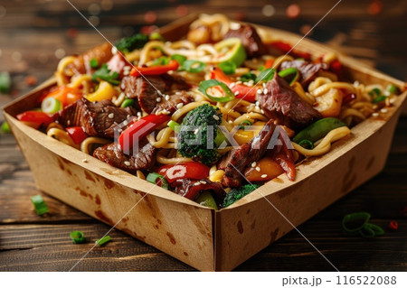 Stir-fry noodles with beef and vegetables in box. 116522088