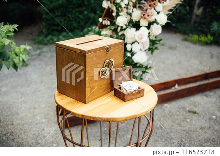Wedding ceremony. Wedding rings are in beautiful box on the table 116523718