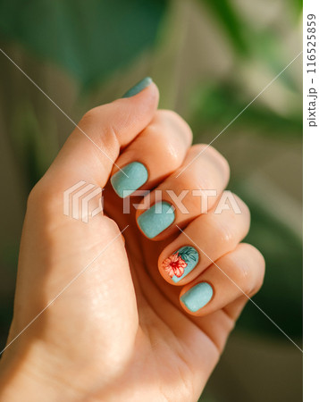 Nails with blue teal design and tropical flower Nails with blue teal design and tropical flower 116525859