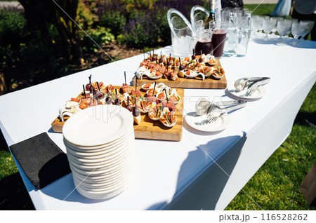 A large selection of food and various snacks at the buffet for guests before the event A large selection of food and various snacks at the buffet for guests before the event 116528262