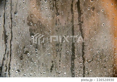 Background of water drops on glass in a shower room along with steam 116528930