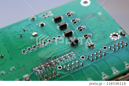 Row of identical microcontrollers soldered into an electronic board Row of identical microcontrollers soldered into an electronic board 116536118