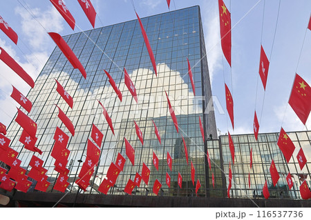 Hong Kong And Chinese Flag with the office building June 24 2024 Hong Kong And Chinese Flag with the office building June 24 2024 116537736
