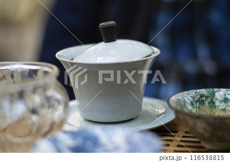 Traditional chinese white porcelain teapot on the table. Tea ceremony Traditional chinese white porcelain teapot on the table. Tea ceremony 116538815
