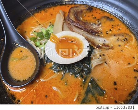 Japanese ramen noodle soup with egg in black pot Japanese ramen noodle soup with egg in black pot 116538831