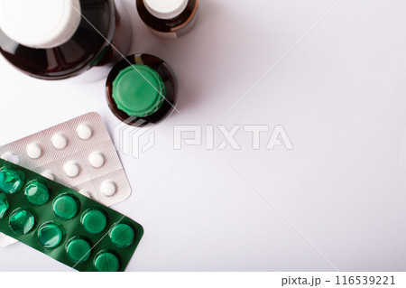 Pills, blister pack and medicine bottles top view. Vitamins, supplements. Concept of health care. Medicine dose. Medicinal treatment. Health. Copy space, online pharmacy banner. High quality photo 116539221