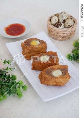 tofu filled with delicious quail eggs 116539928