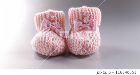 Handicraft shoes for newborn baby on grey background 116540353