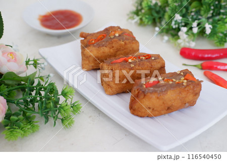 Spicy fried tofu filled with meat 116540450