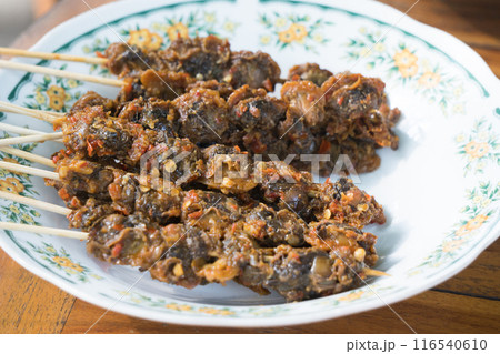 an Indonesian dish called sate kerang. an Indonesian dish called sate kerang. 116540610