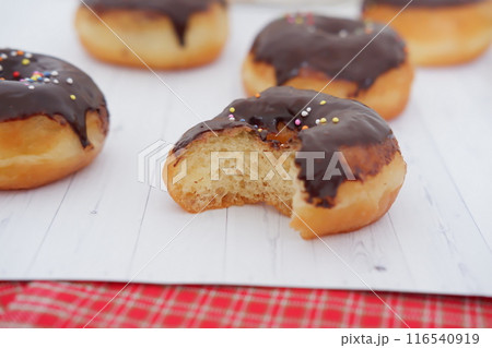 donuts with delicious chocolate coating as a background 116540919
