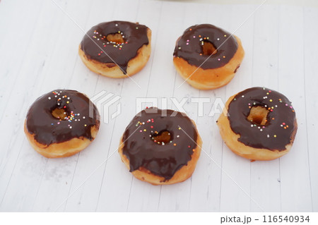 donuts with delicious chocolate coating as a background 116540934
