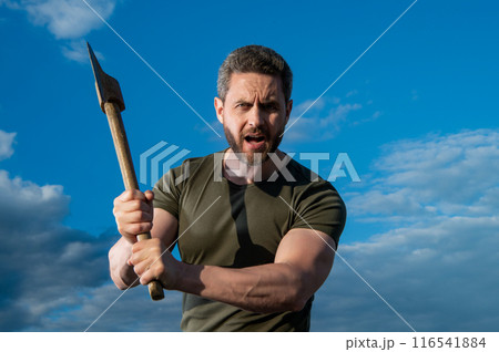 man threaten with axe. shouting man hold ax. brutal man on sky background man threaten with axe. shouting man hold ax. brutal man on sky background 116541884