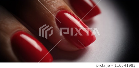 Red bright manicure on female hands closeup 116541983
