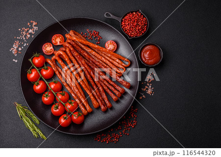 Mini sausages or cabanosi smoked with salt and spices Mini sausages or cabanosi smoked with salt and spices 116544320
