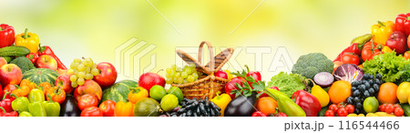 Collection bright berries, fruits and vegetables on green background. 116544466