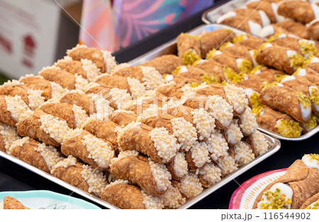 Cannoli Italian pastries filled sweet, creamy filling, ricotta. Sicilian cuisine, various sizes 116544902